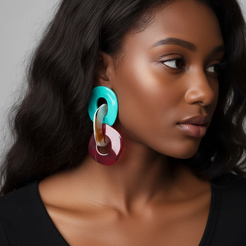 House of eLLe Never A Dull Moment acrylic chain link drop earrings in multi-color red, white, and turquoise.