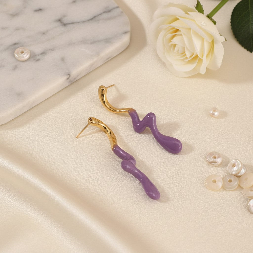 House of eLLe Dripped In Glam stainless-steel earrings featuring a wavy gold-tone top and purple enamel bottom.