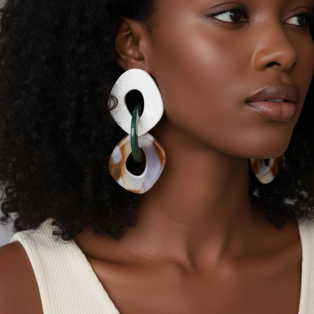 House of eLLe Never A Dull Moment earrings in brown, green, and white abstract marbled acrylic shapes.