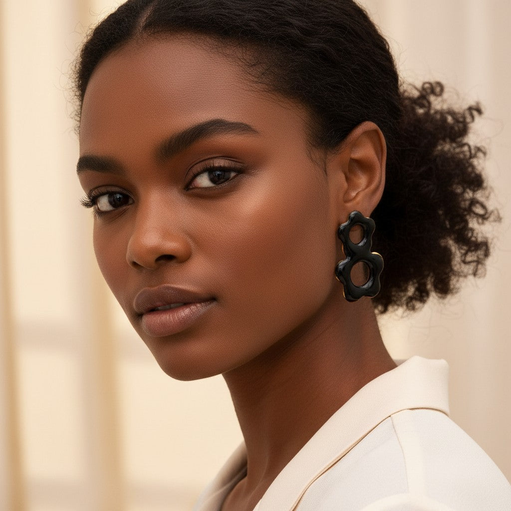 House of eLLe Flow Vibes earrings in black stainless steel with a unique organic flower-like shape on a model