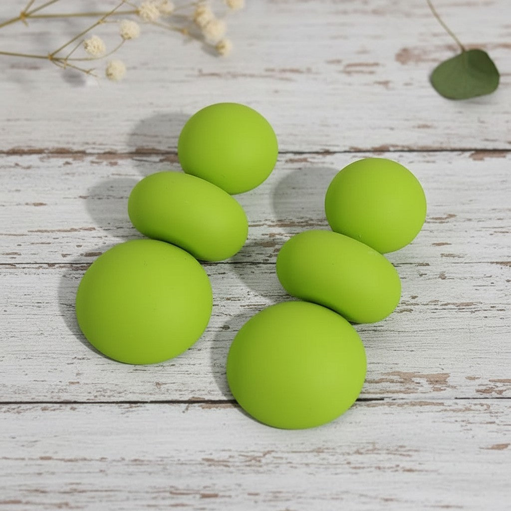 House of eLLe I'm Flexible earrings in bright lime green with smooth, rounded silicone-style geometric shapes.