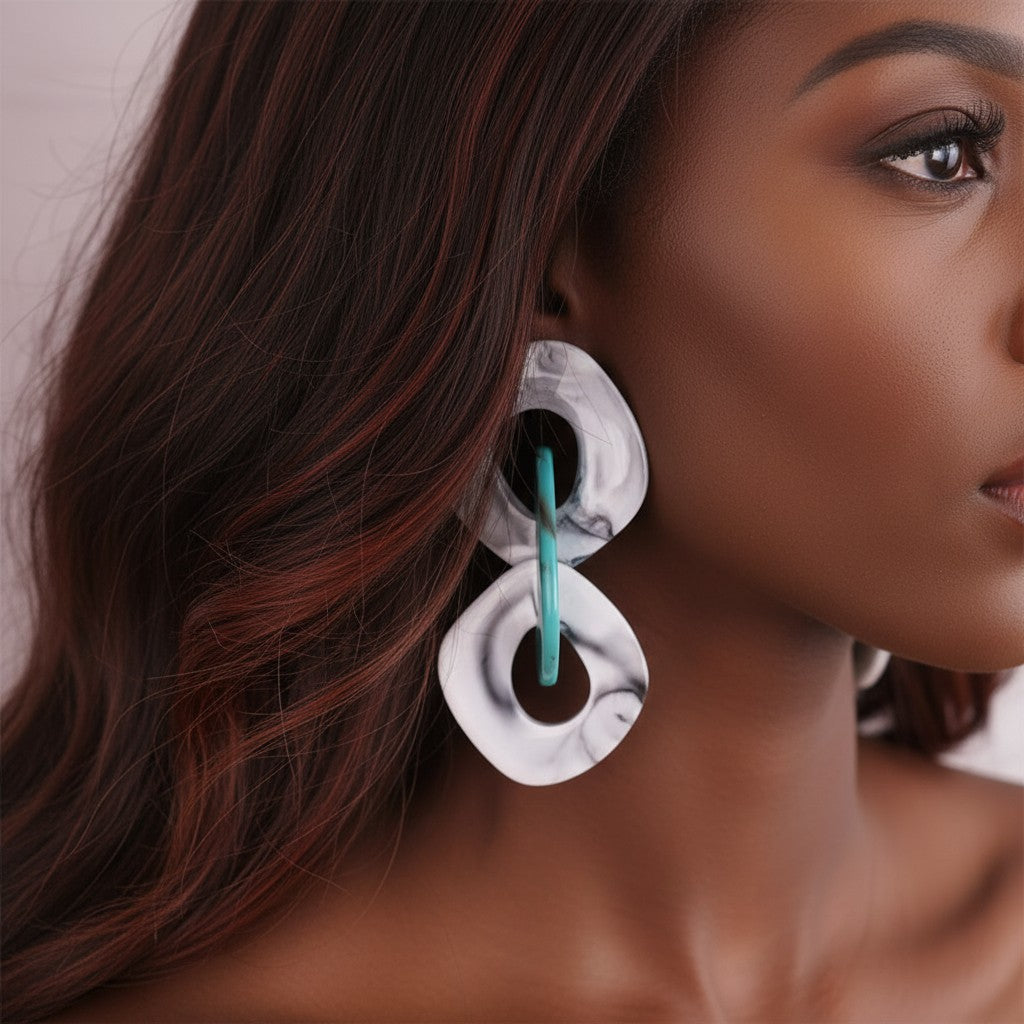 House of eLLe Never A Dull Moment earrings in gray, teal, and white marbled acrylic with a unique geometric shape.