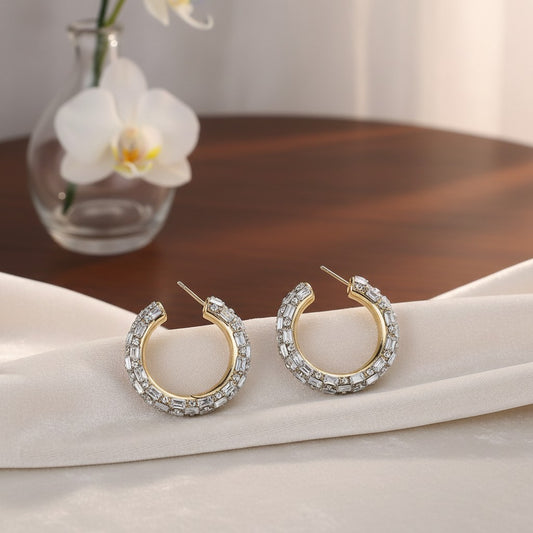House of eLLe Life Of The Party hoop earrings featuring baguette-cut white crystals set in gold-tone metal.