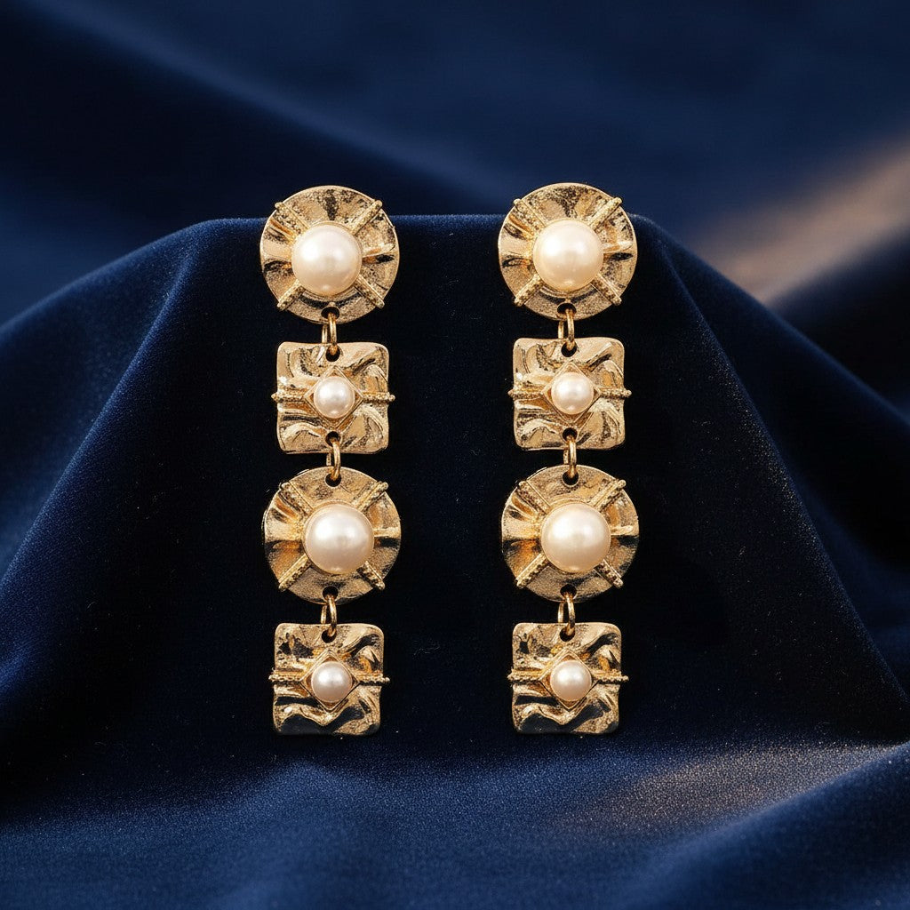 House of eLLe Four Reasons drop earrings featuring textured gold-tone metal squares and circles with inset pearls.
