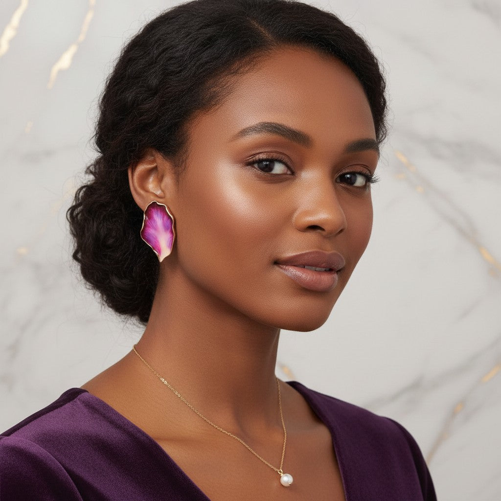 House of eLLe Beautiful Me earrings featuring a gradient rose red petal design worn by a woman in a purple dress.