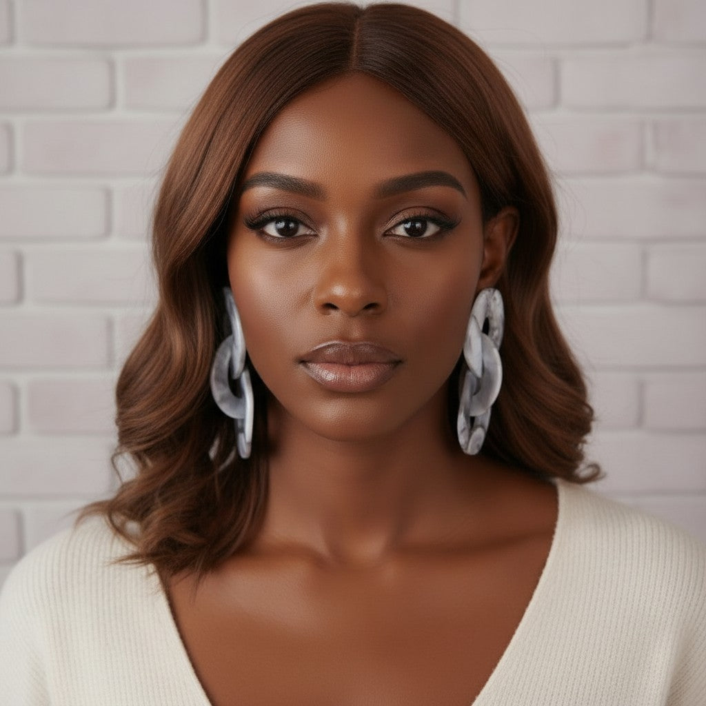House of eLLe Gray marbled acrylic link drop earrings on a model.