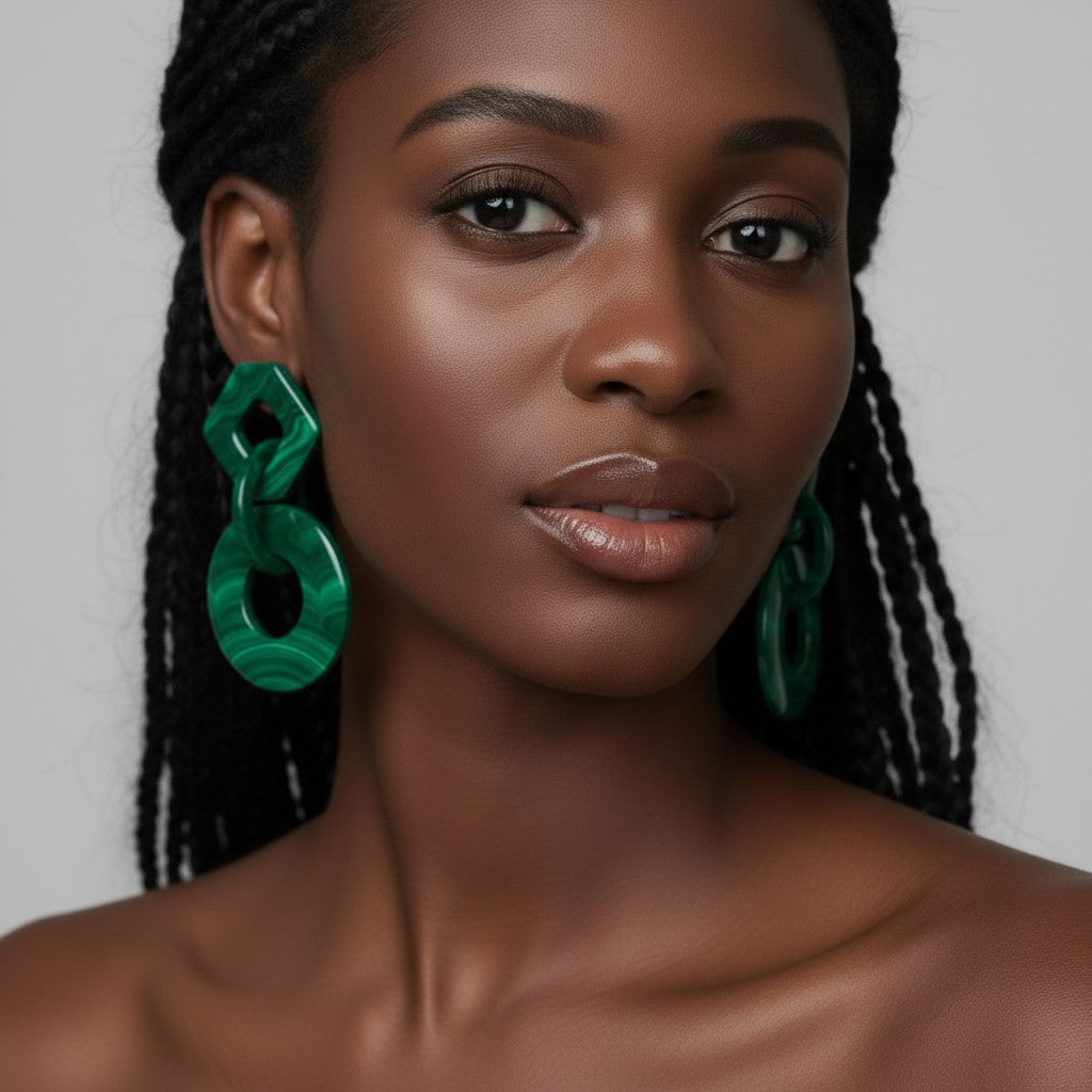 House of eLLe green malachite geometric drop earrings with a diamond shape above a circle.