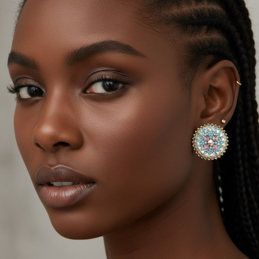 House of eLLe round stud earrings with iridescent blue and pink geometric crystal mosaic design and gold trim.