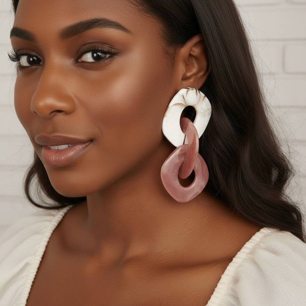 House of eLLe Never A Dull Moment earrings in brown and pink marbled acrylic, featuring interlocking square links.