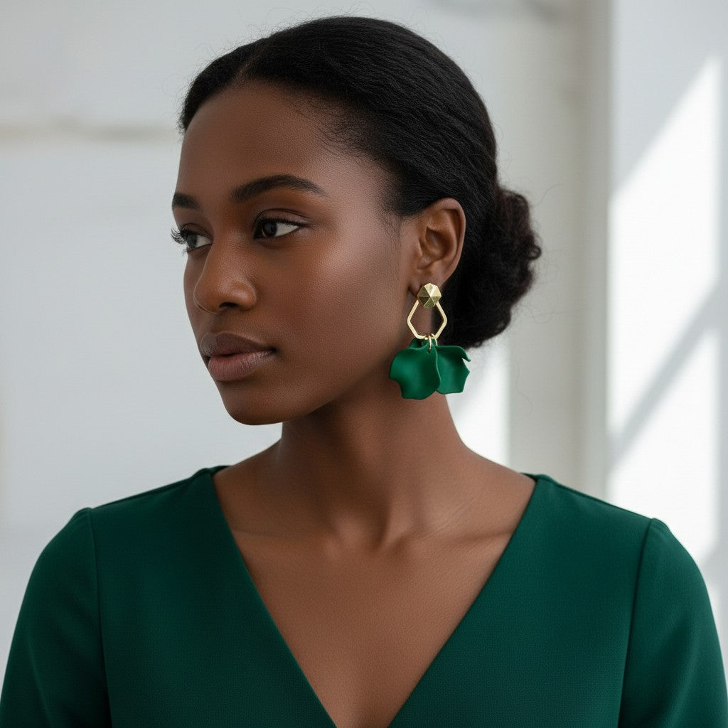 Model wearing House of eLLe Mini Falling For You green acrylic drop earrings with gold geometric accents.