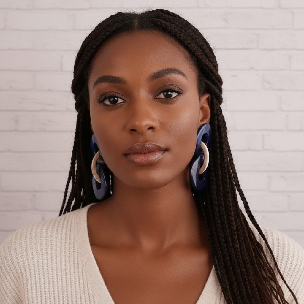 House of eLLe Never A Dull Moment earrings in blue and brown, featuring interlocking geometric shapes.