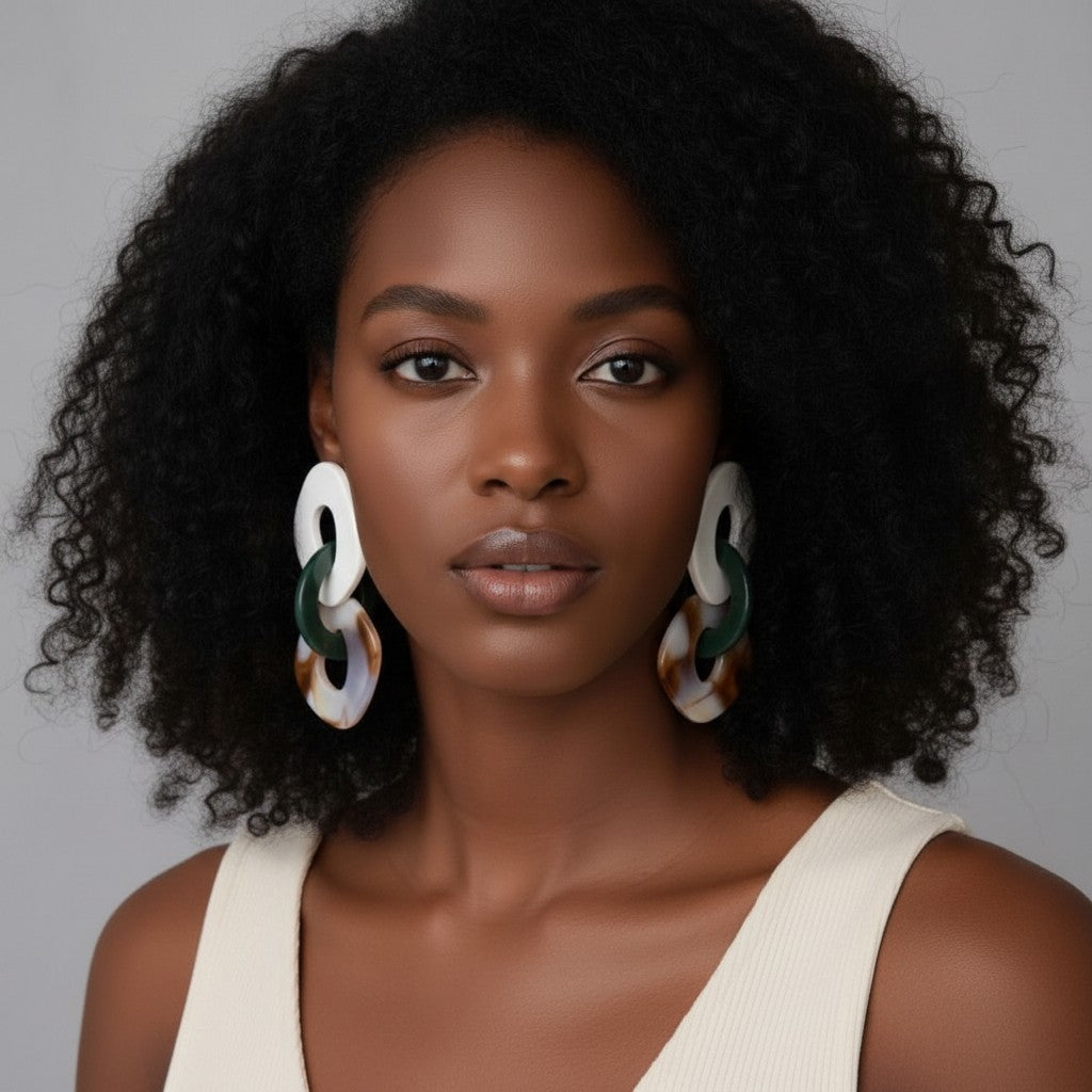 House of eLLe Never A Dull Moment earrings with white and marbled brown/green acrylic shapes.