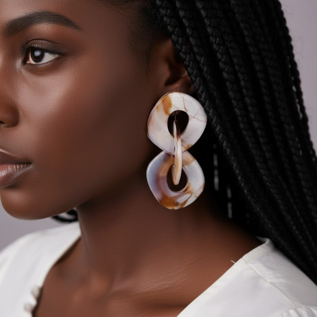 House of eLLe Never A Dull Moment earrings in brown and white marbled resin with a unique abstract shape.