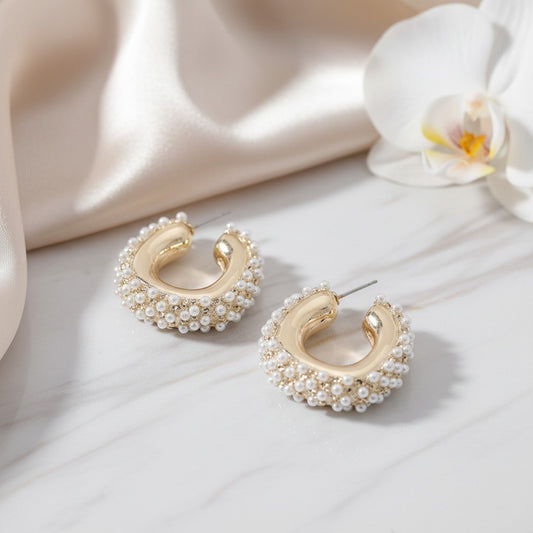 House of eLLe Mini Life Of The Party hoop earrings featuring gold-tone metal accented with small white pearls.