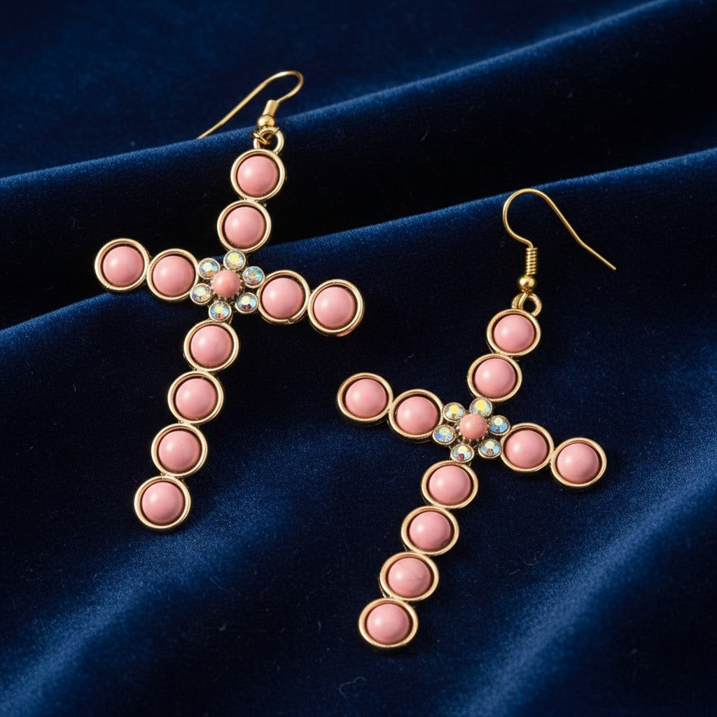 House of eLLe light pink cross earrings featuring gold-tone metal, round pink beads, and central crystal accents.