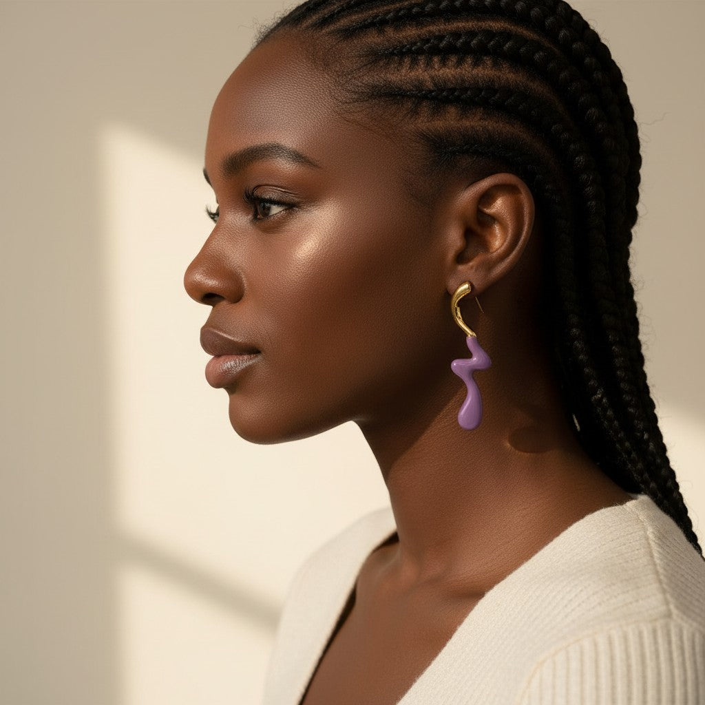 House of eLLe Dripped In Glam stainless-steel earrings featuring a wavy purple drop design on a model