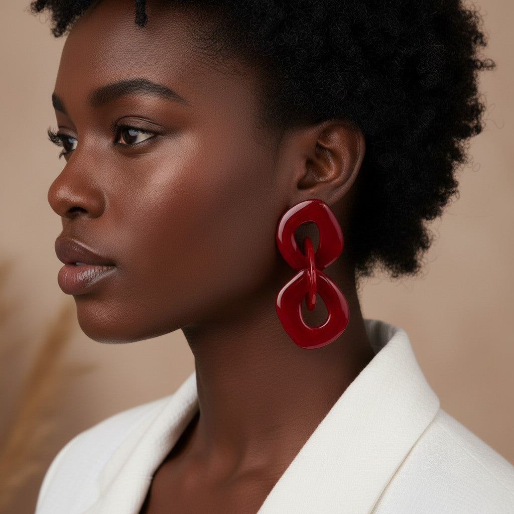House of eLLe Never A Dull Moment statement earrings in bold red acrylic, featuring interlocking geometric shapes.