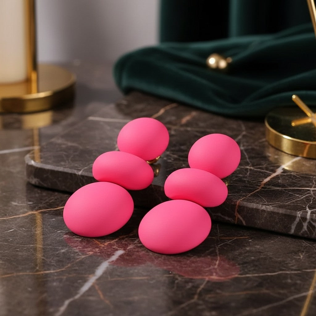 House of eLLe I'm Flexible rose red statement earrings featuring stacked matte oval shapes on a marble surface.