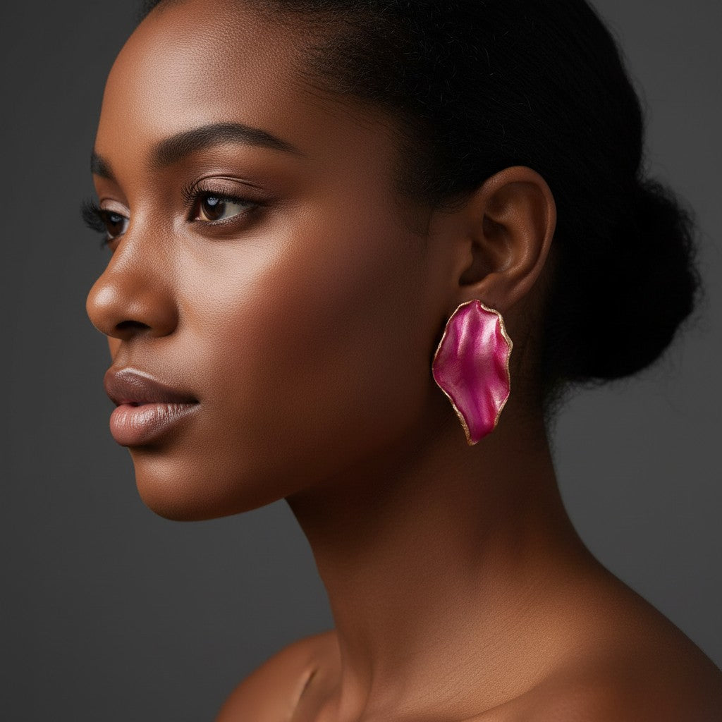 House of eLLe Beautiful Me earrings in rose red with a unique organic petal shape worn by a model in profile view.