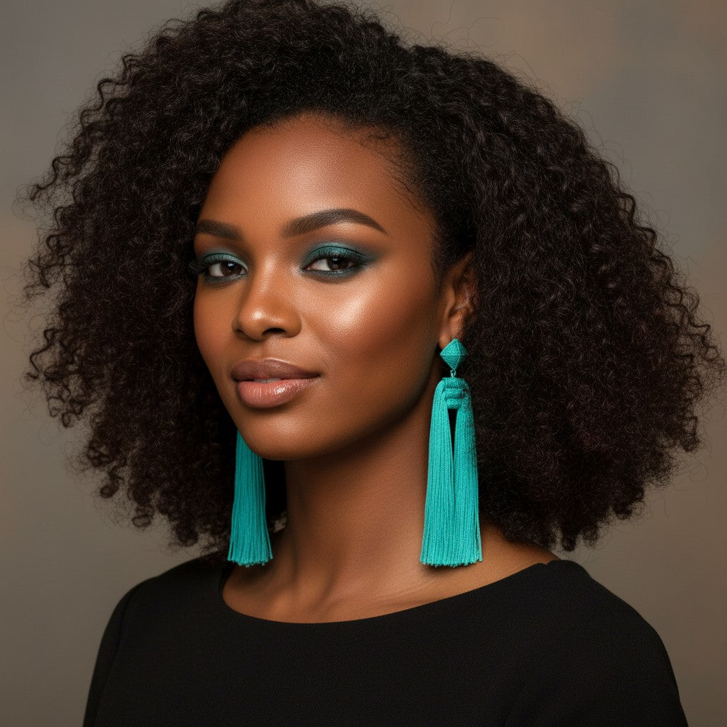 House of eLLe Queen Era earrings in sky blue featuring a geometric stud and long silk tassel design on a model.