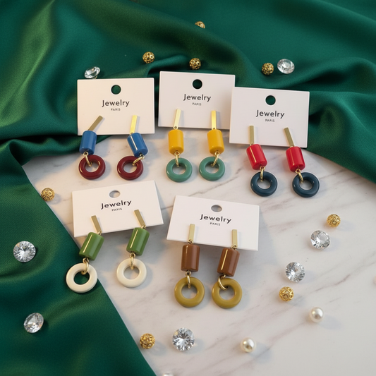 House of eLLe Two Personalities earrings featuring geometric yellow and green resin beads on gold-tone metal posts.